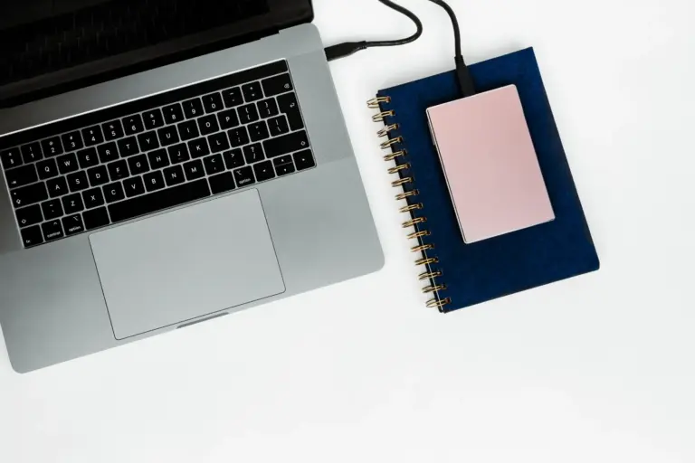 NAS and external backup drive on an office shelf