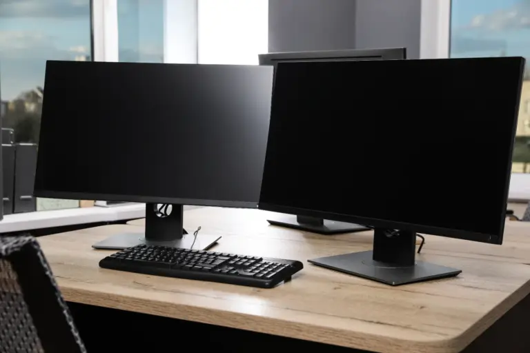 Business PC with dual monitors on a clean desk