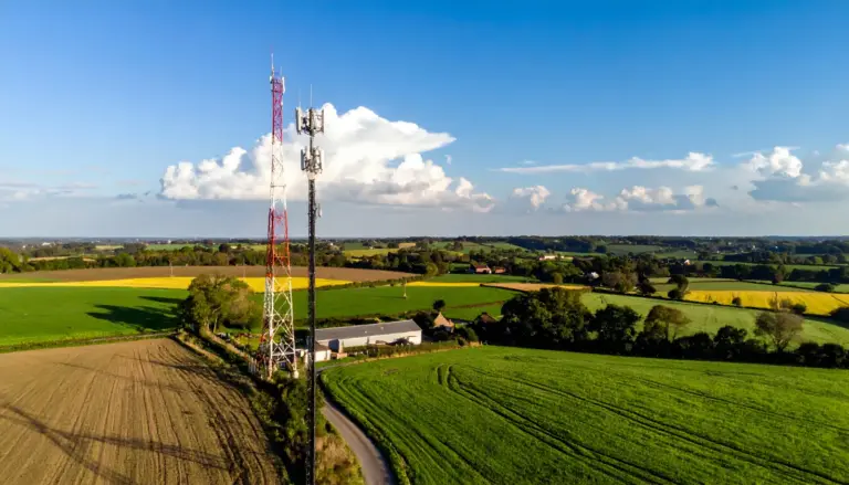 Point-to-point wireless antenna on a farm building at sunset