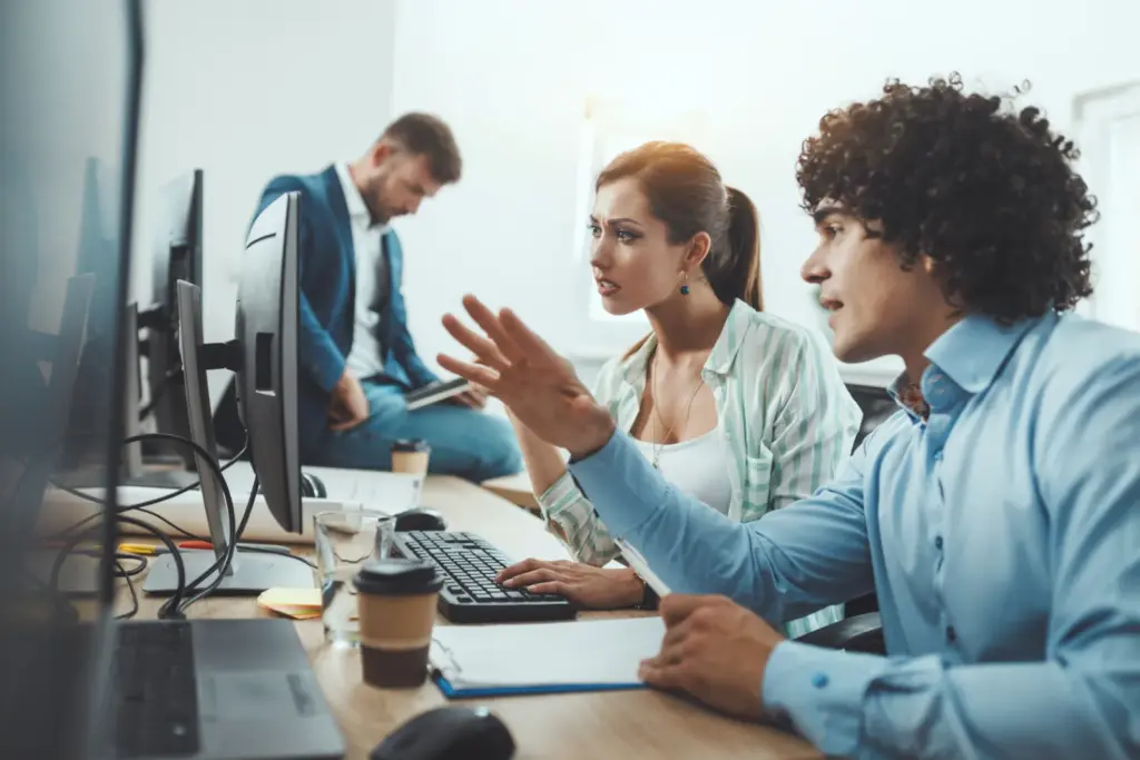 Small office team working while systems are monitored
