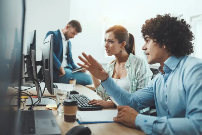 Small office team working while systems are monitored